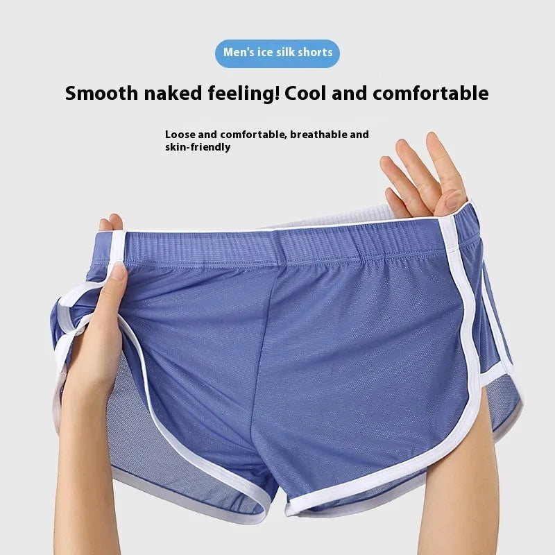 Men's ice silk mesh sports boxer briefs in black, shown laid flat to detail low waist and thin fabric.