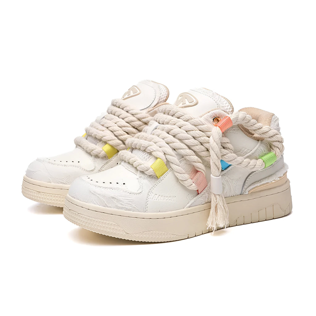 Creamy white retro skate shoes with old damage lace detailing and rubber soles