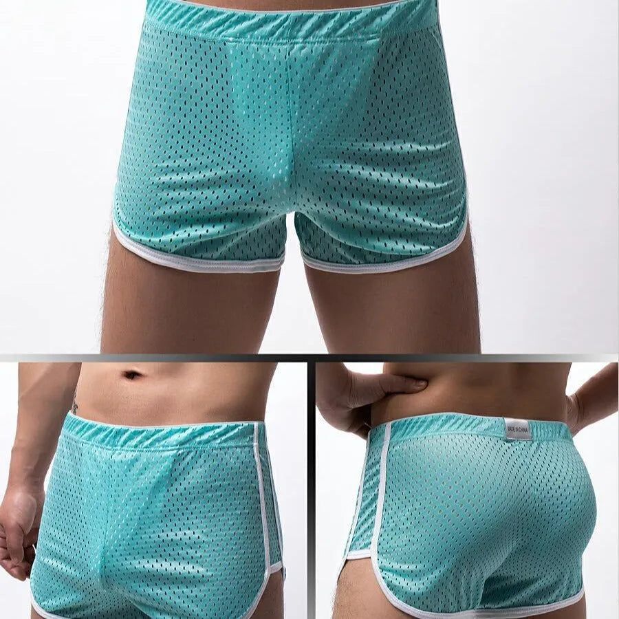Men's cotton blend boxer shorts in black, showing mid waist and breathable knit fabric.
