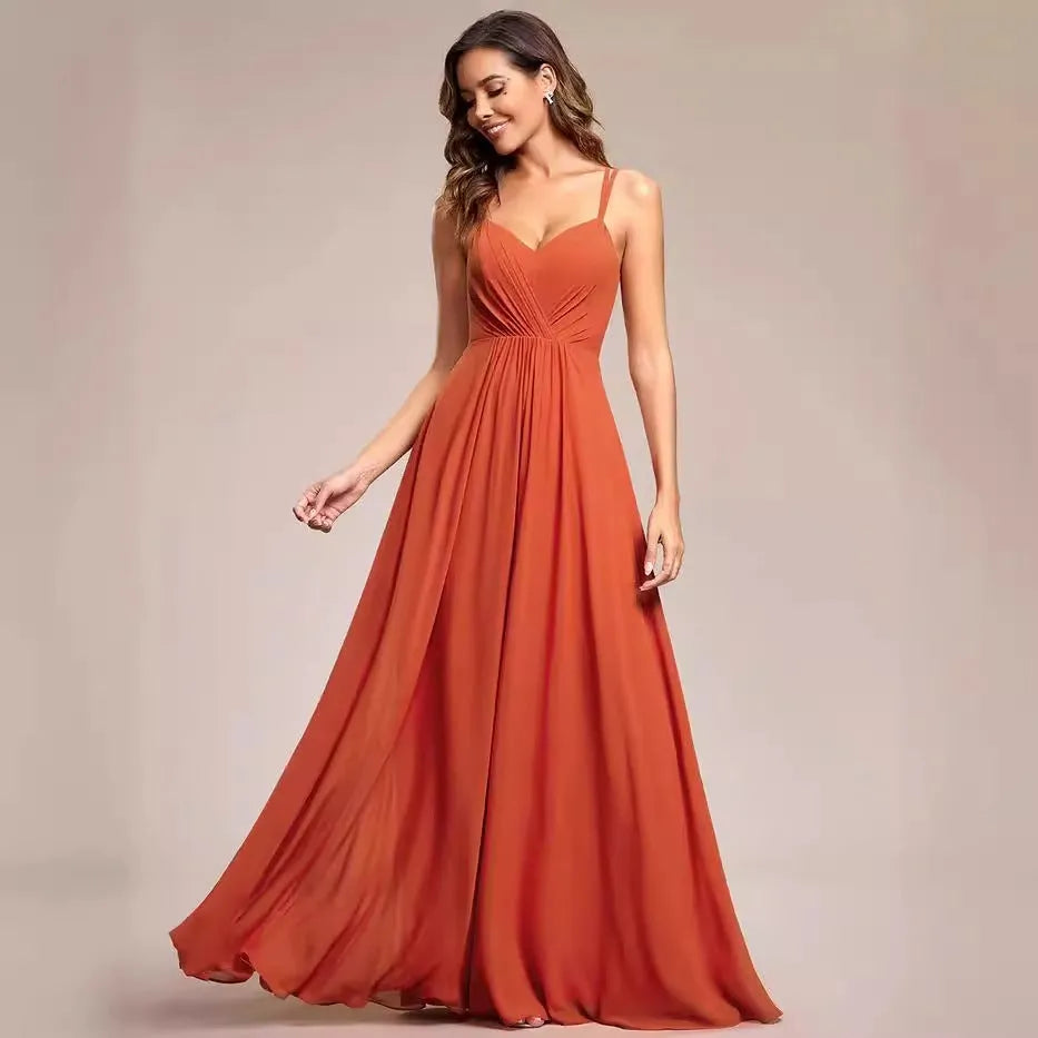 Long pleated A-line dress in light green with sleeveless sling neckline design.