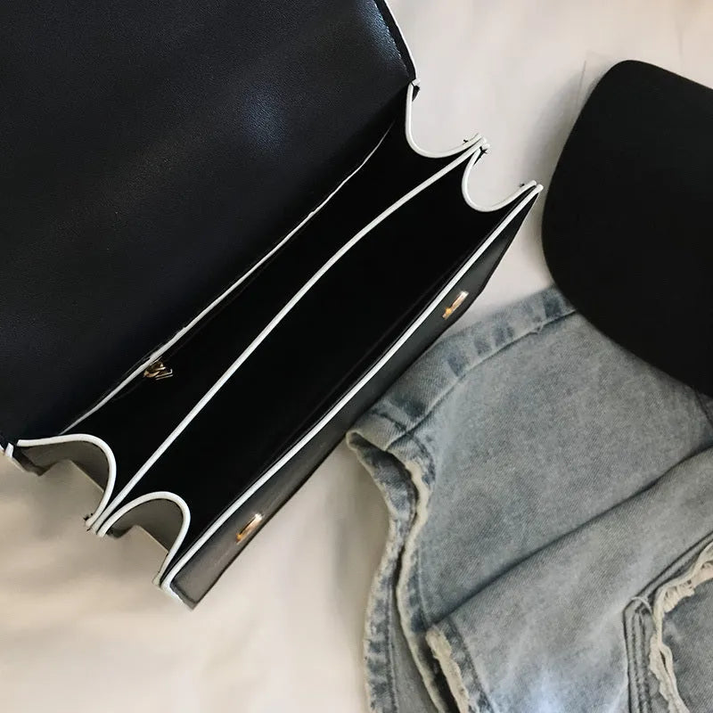 Women's designer diamond lock shoulder bag in quality PU leather, available in Black and Blanco colour options