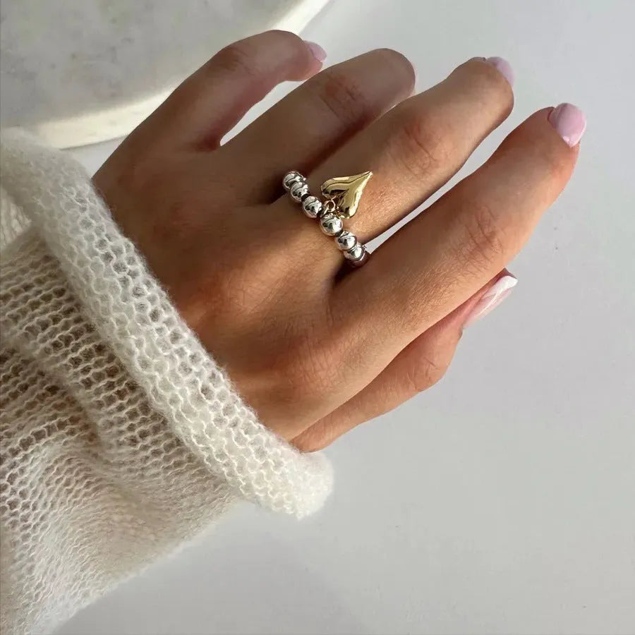 Handmade beaded elastic ring with geometric heart design in gold or silver electroplated finish