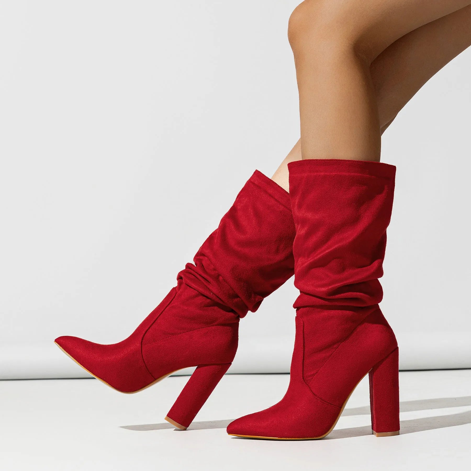Women's black suede pointed-toe boots with chunky heel and mid-calf length