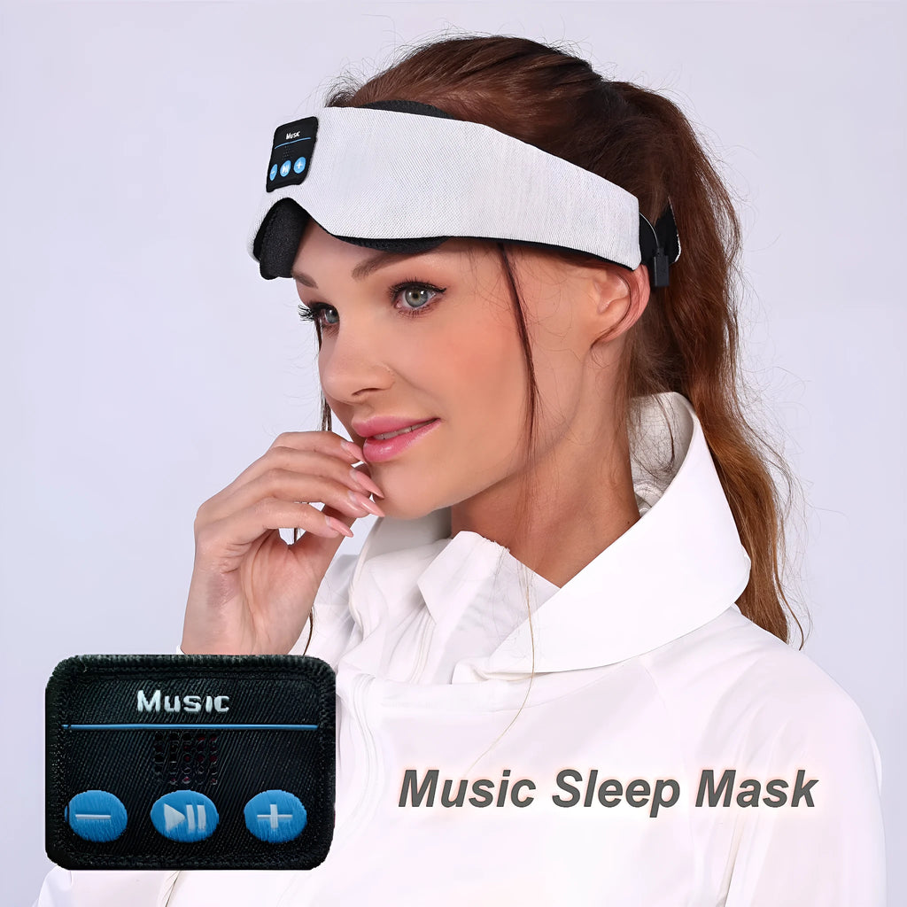 Grey contour Bluetooth sleeping eye mask with built-in speakers for wireless music playback.