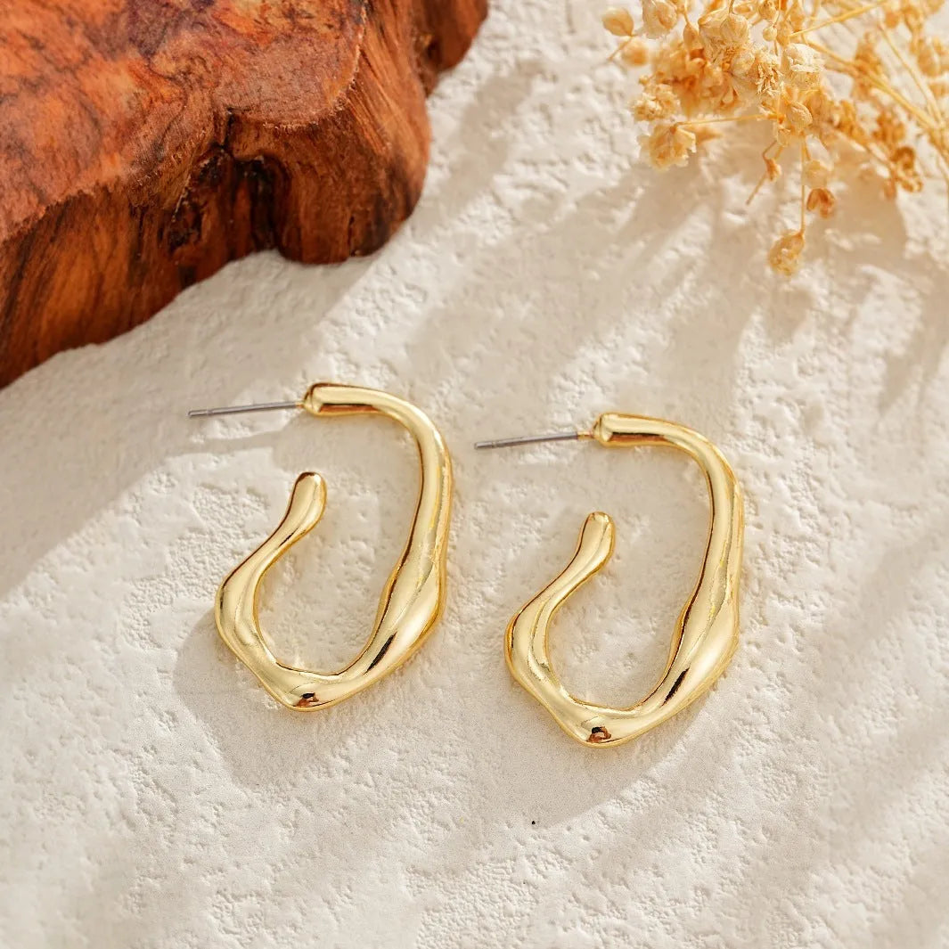 Irregular shaped minimalist drop earrings for women in gold colour metal