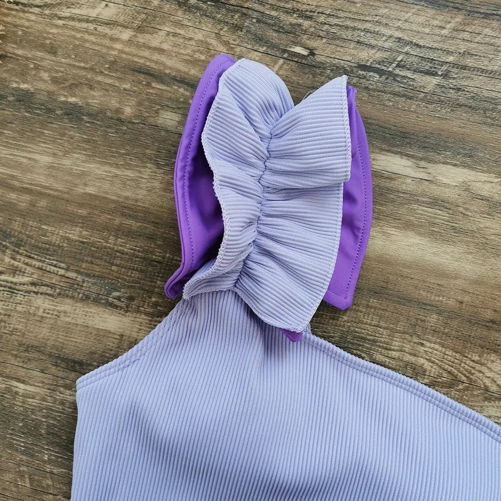 Women's single-shoulder suspender tube top one-piece swimsuit in a high-waist cut, shown in a solid colour.