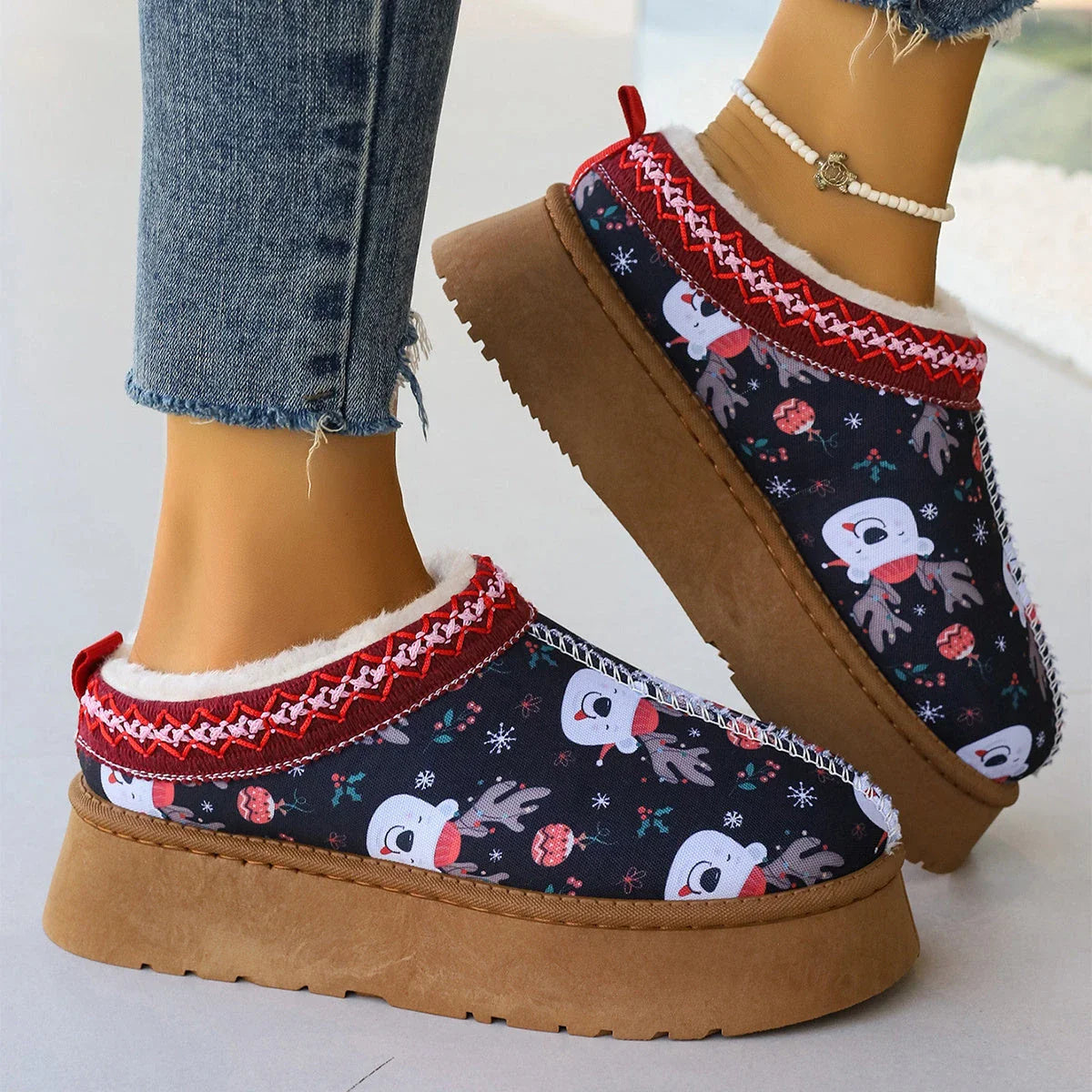 Women's festive plush-lined winter ankle boots with Christmas print, perfect for adding warmth and style to your winter wardrobe.