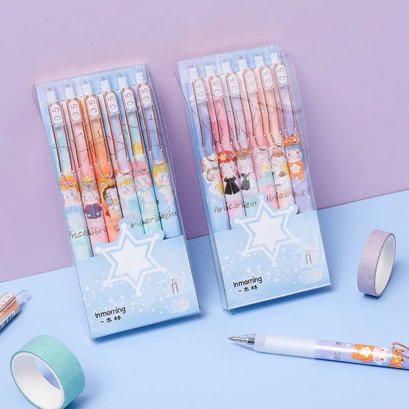 Six constellation-themed 0.5mm press gel pens with zodiac designs in plastic shells