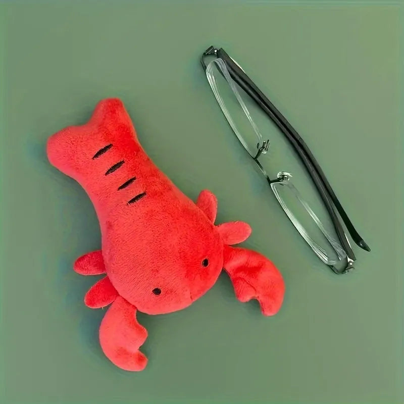 Red lobster stuffed dog toy with flapping tentacles on white background