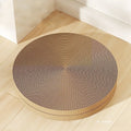 A round green cat scratching board made of corrugated cardboard, 55cm across, with two spare refills.