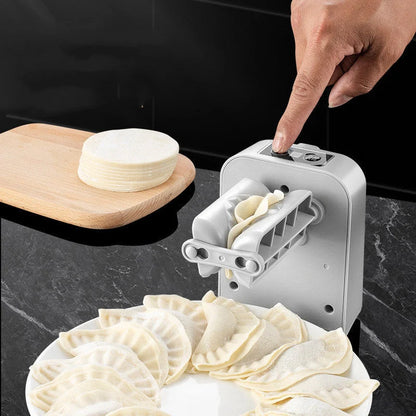 Electric Dumpling Maker Machine on kitchen counter with dumplings