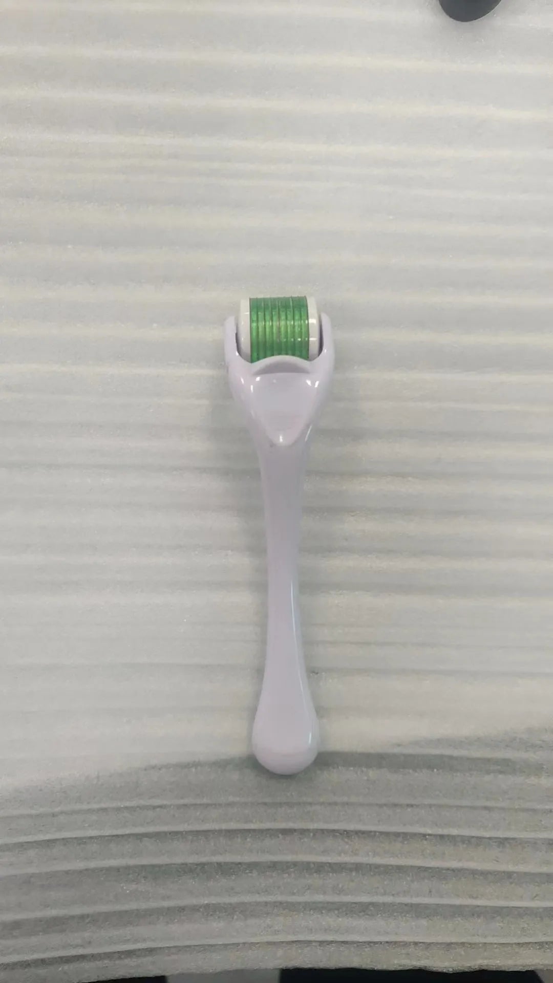 540 needle microneedle derma roller with colour wheel on black handle, showing 0.25mm specification.