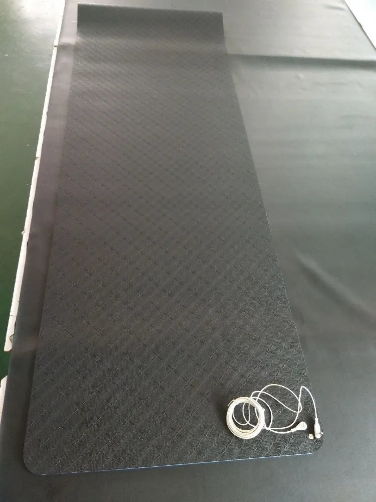 Blue conductive yoga mat with plants pattern, 182cm long, showing integrated grounding wire on non-slip PU surface.