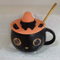 Black ceramic cat-shaped mug with pumpkin spoon couple design, 355ml capacity.