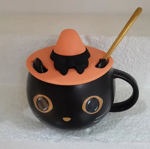Black ceramic cat-shaped mug with pumpkin spoon couple design, 355ml capacity.