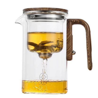 Elegant glass teapot with magnetic separation technology, wooden handle, and drip-free spout for a consistently smooth and flavorful cup of tea