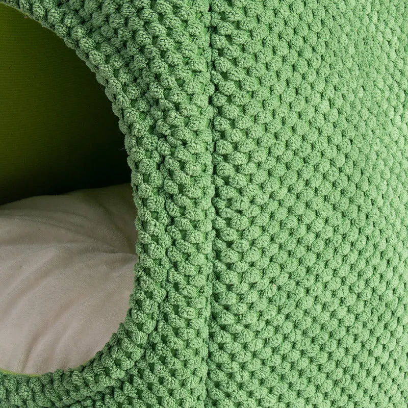 Green enclosed cat cave bed for kittens and small dogs, showing cosy interior.
