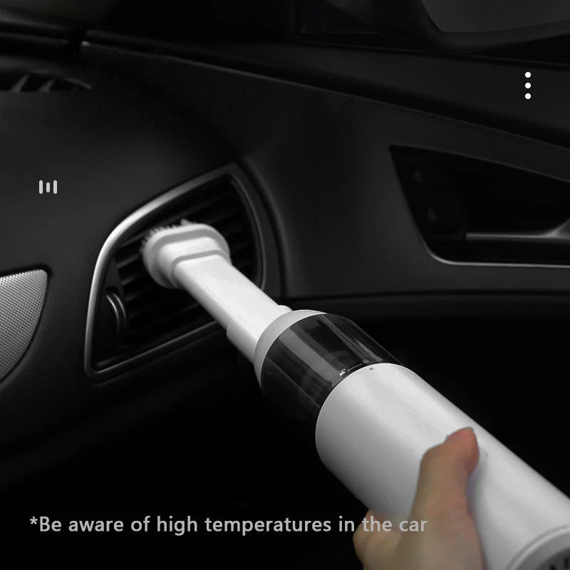 Mini car vacuum cleaner with wireless charging in black and white