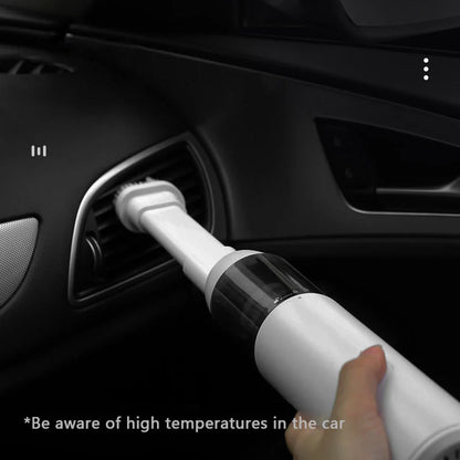 Mini car vacuum cleaner with wireless charging in black and white