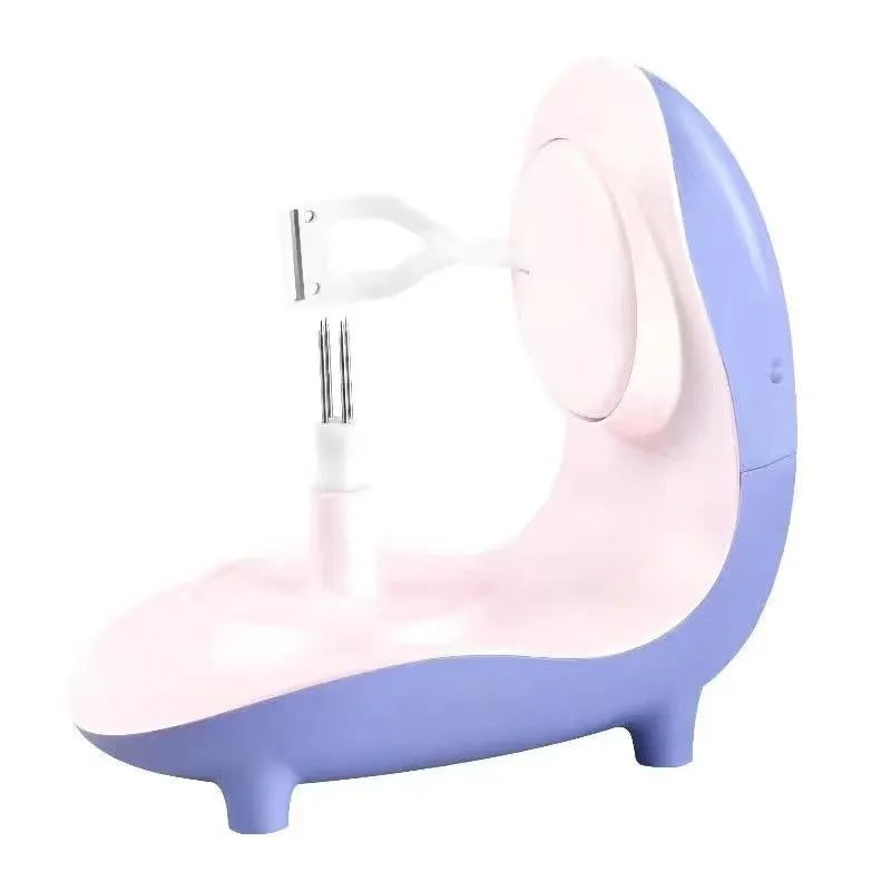 Purple household USB charging electric peeling machine with stainless steel blade on a kitchen counter