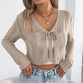 Women's khaki casual coat with hollow-out pattern and front lace-up fastening, long sleeves.