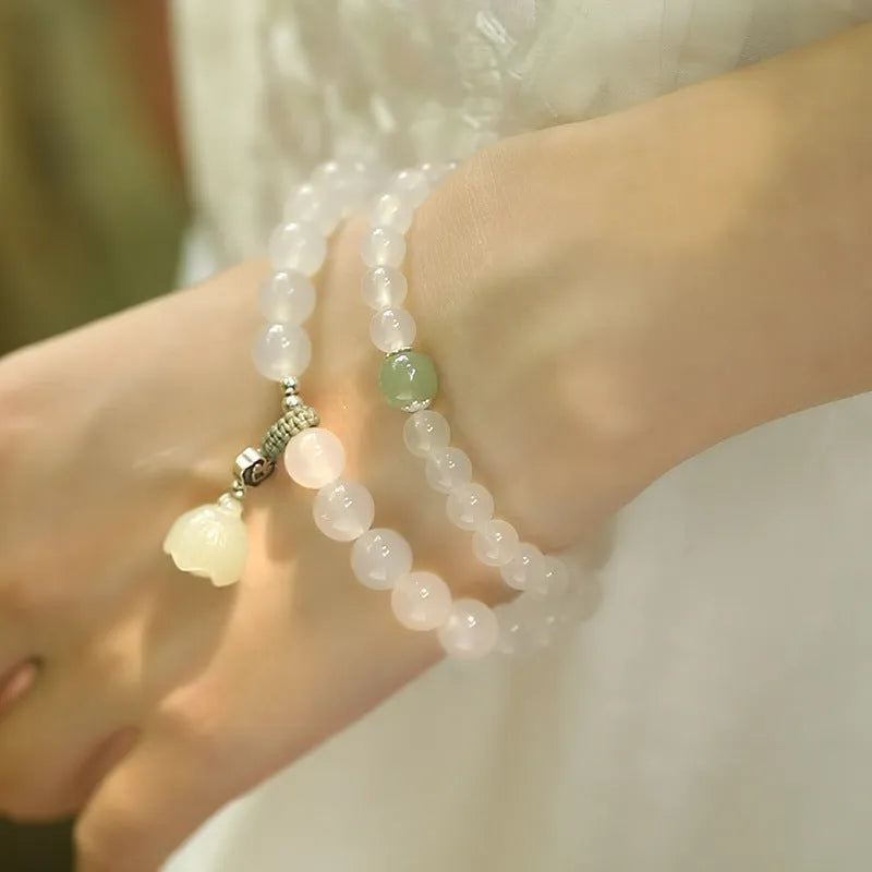 S925 silver bracelet with white agate and Hetian jade stones forming a geometric lotus design.