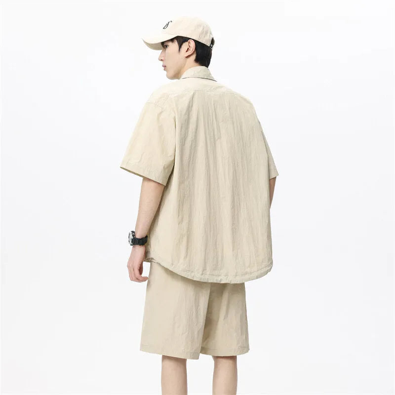 Men's loose grey hemp-blend casual shirt and shorts two-piece set on a hanger