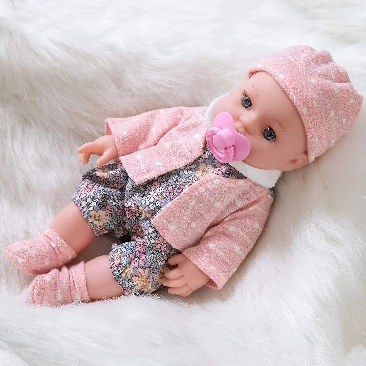 Full vinyl baby doll 30cm with changeable clothes suit in TM-010 colour option, standing on a plain background