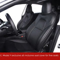 Black PVC chloroprene car seat cover fitted on a Tesla Model 3 front seat.