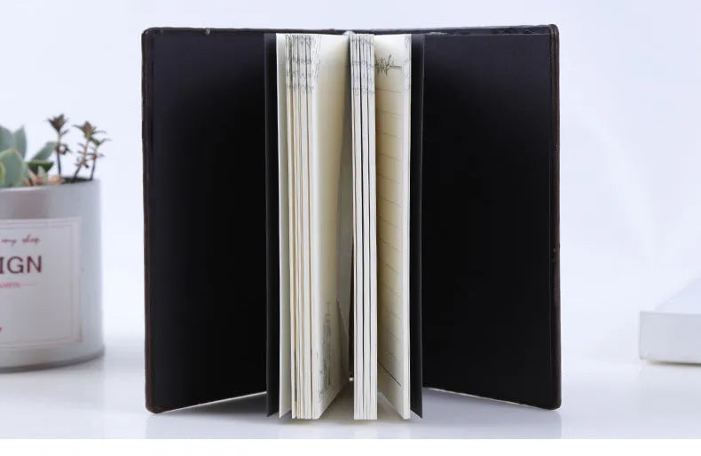 European-style embossed PU hardcover notebook with beige paper pages, 13.5x20.5cm, brushed bronze accents
