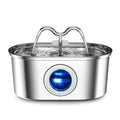 Stainless steel elliptical pet water fountain with detachable pump and filter on a floor