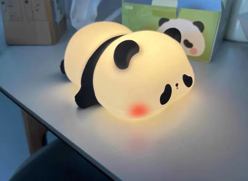 Cute silicone night light sheep cartoon bedroom lamp with warm light, rechargeable, on a bedside table