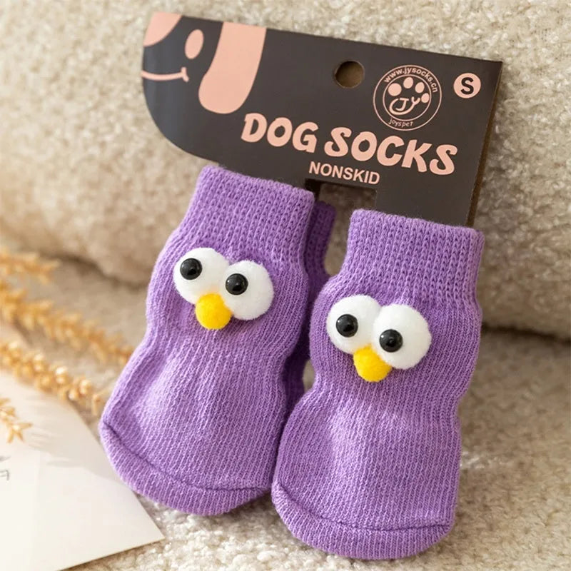 Dog all-season universal cotton socks with cute big eyes, anti-slip sole, green colour, side view on wooden floor
