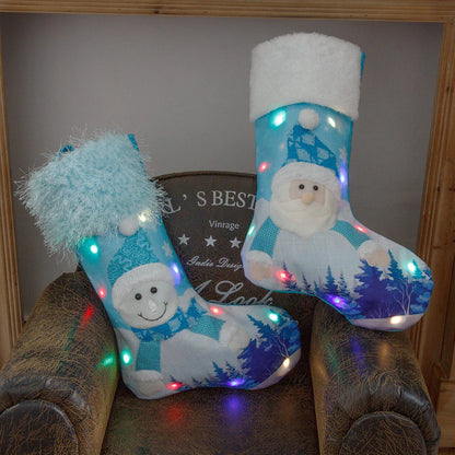 Magical luminous Christmas socks with Santa Claus and Snowman designs, featuring warm, glowing lights for festive holiday home decor