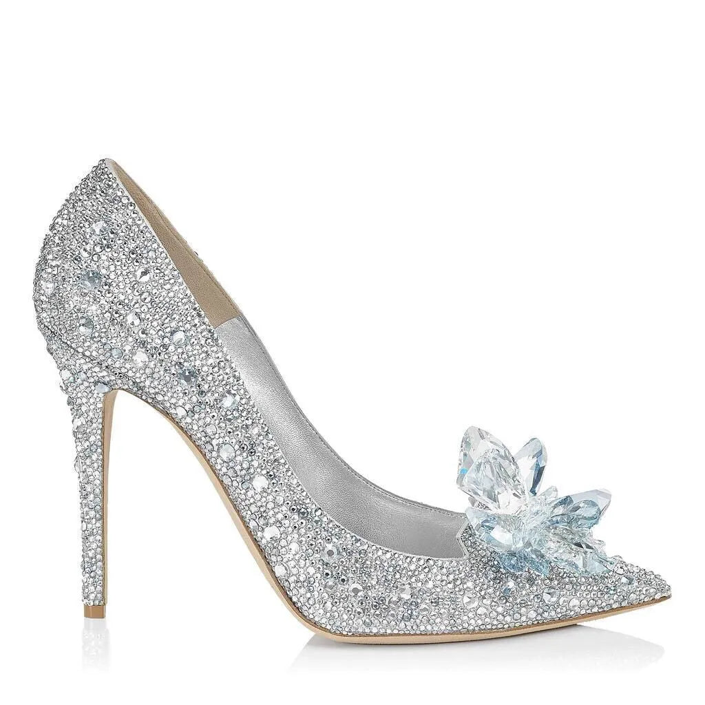 Women's gold sequinned pointed toe high heels with rhinestone details and a stiletto heel.