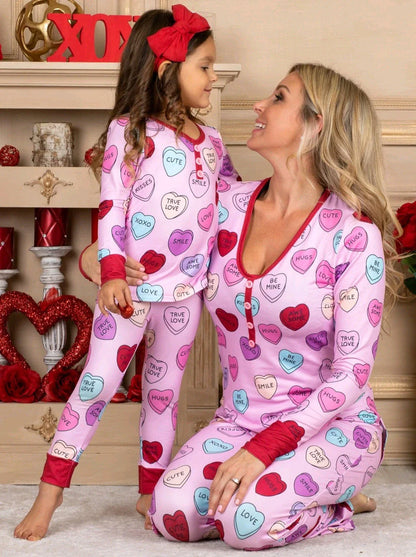 Valentines Day family pajamas with a cozy heart print design for parents and children