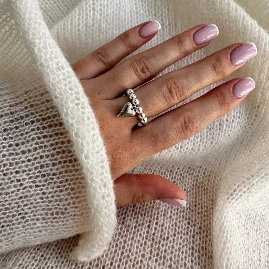 Handmade beaded elastic ring with geometric heart design in gold or silver electroplated finish