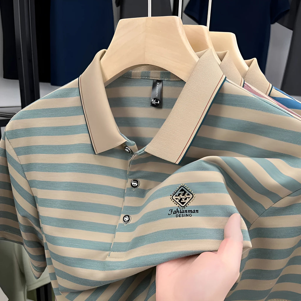 A man wearing a red, blue, or green striped short sleeve casual shirt with a mosaic pattern detail.