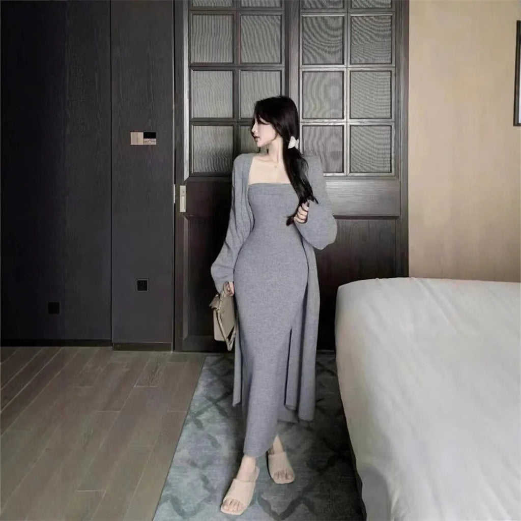 Women's grey knitted cardigan dress suit set with long skirt and flocking detail.