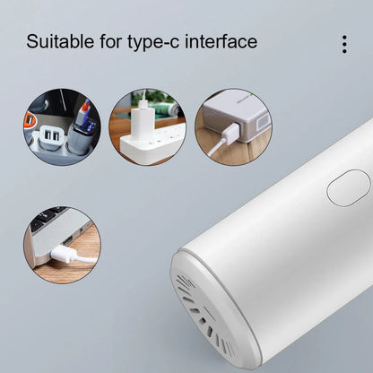 Mini car vacuum cleaner with wireless charging in black and white