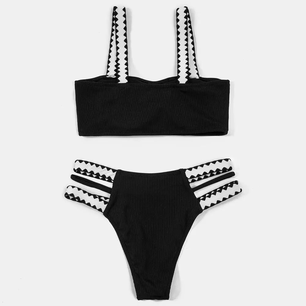 Black women's hollowed-out split swimsuit bikini set with cut-out design detail