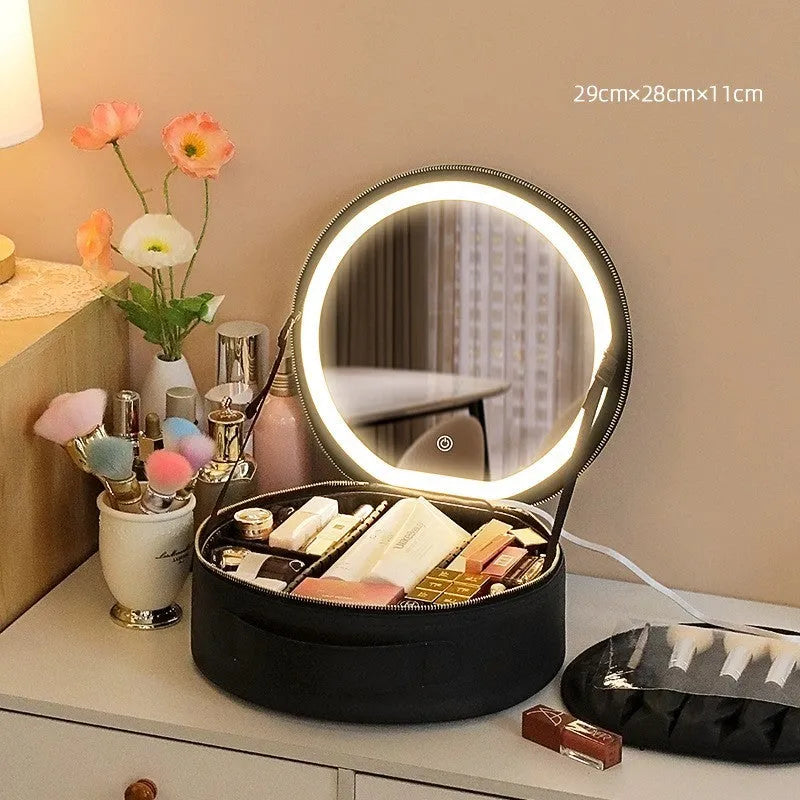 Round pink LED makeup bag open showing internal partitions and illuminated mirror.