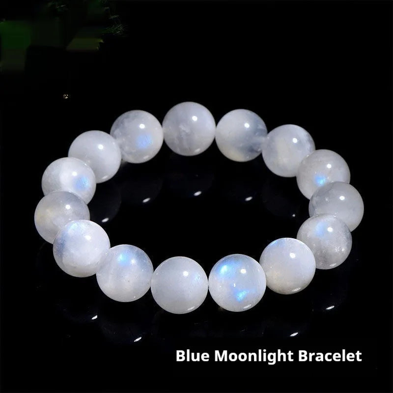Natural blue moonlight round bead moonstone bracelet in white, showing polished stone surface.