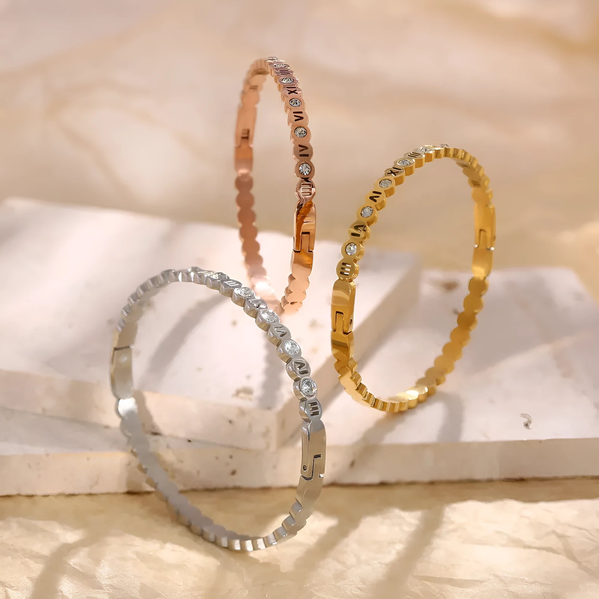 Korean style titanium steel bracelet with an adjustable number charm in gold, rose gold, or steel colour.