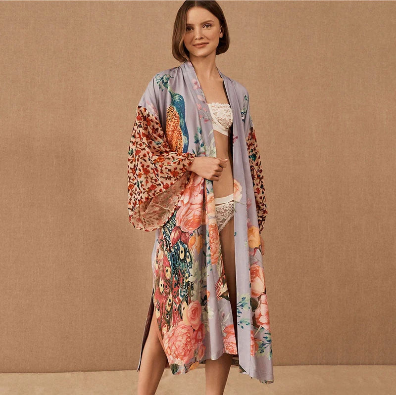 Peacock print beach cover-up in light pink and milky white, offering sun protection and style