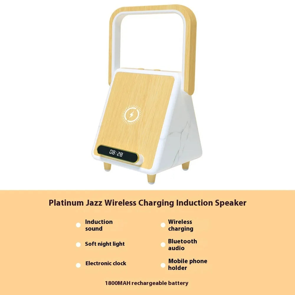 Wireless charging induction Bluetooth speaker small night lamp in Platinum Jazz finish with USB cable on a wooden desk