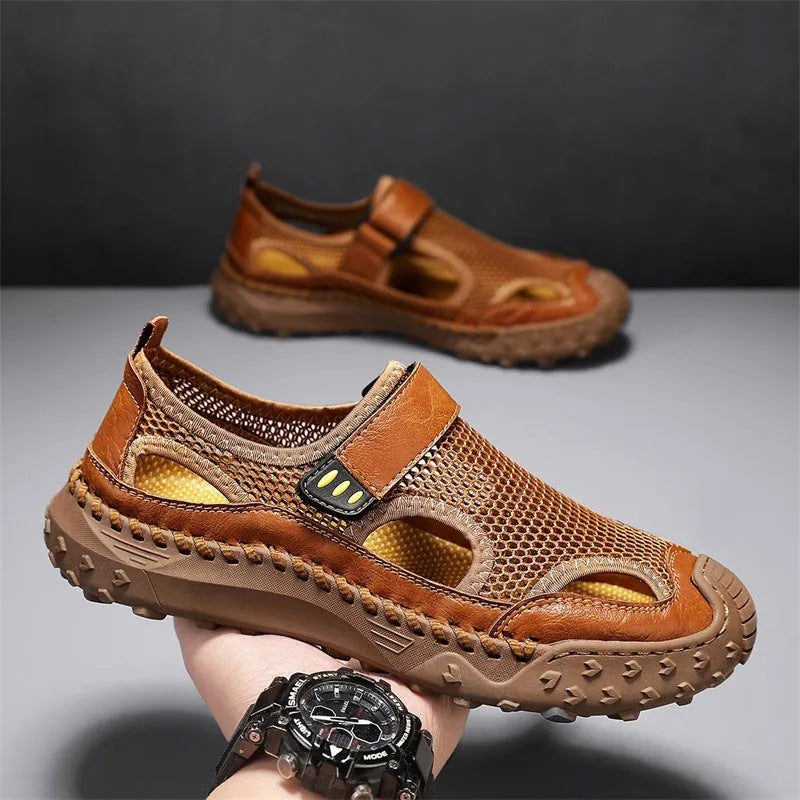 Men's black casual sandals with a mesh upper and velcro strap on a rubber sole.