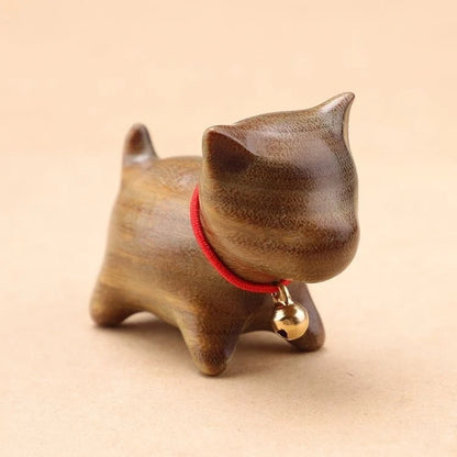 Handcrafted sandalwood kitten ornaments in various styles and colours