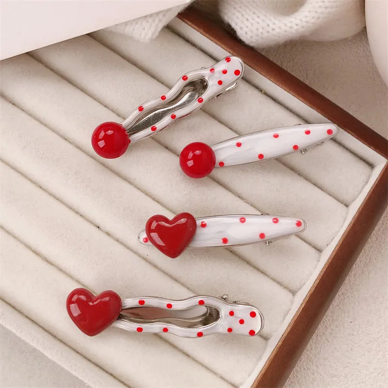 Red stereo love heart-shaped hair clip with French retro dots and willow leaf design.