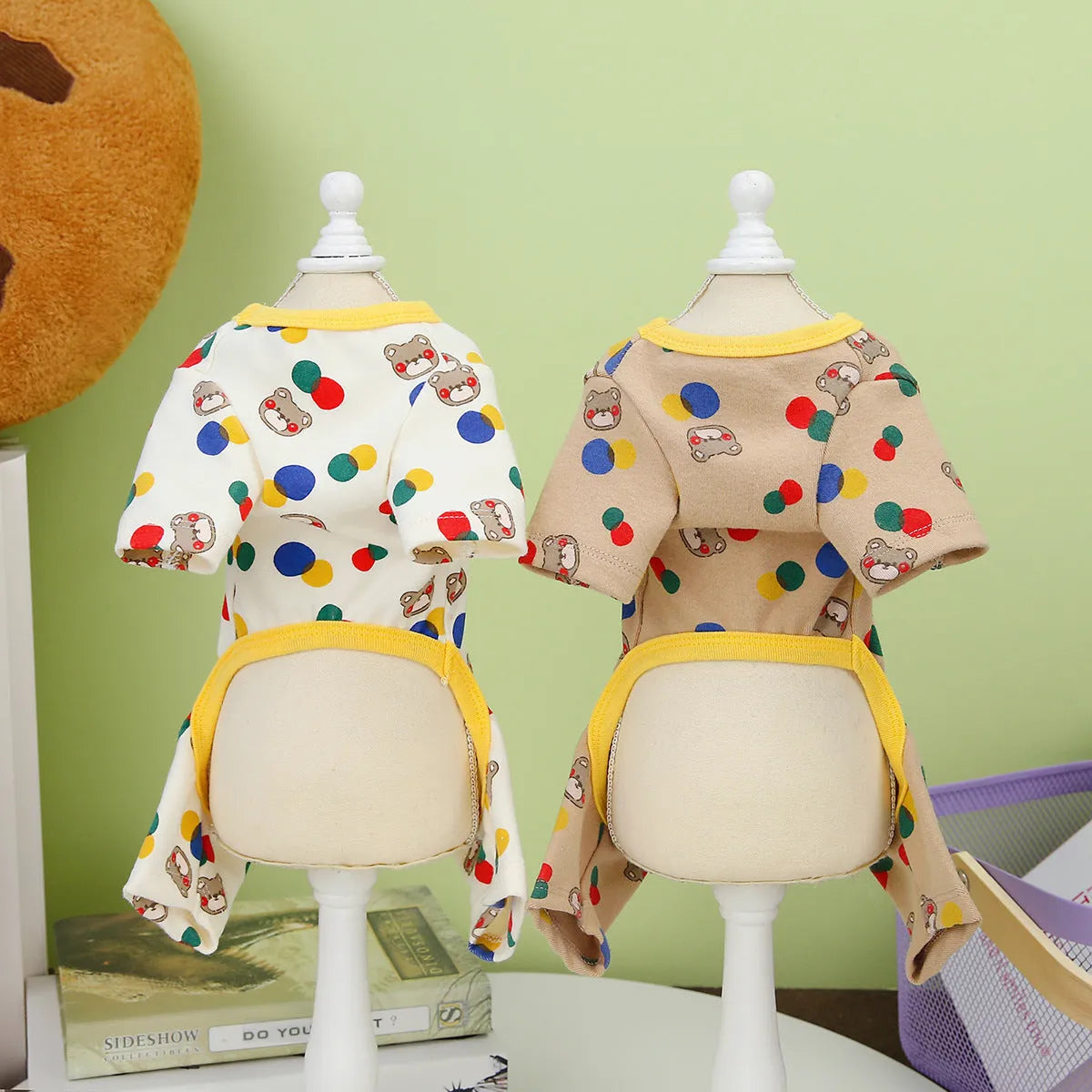 Beige dog costume with colourful ball bear design, made from cotton and spandex blend.